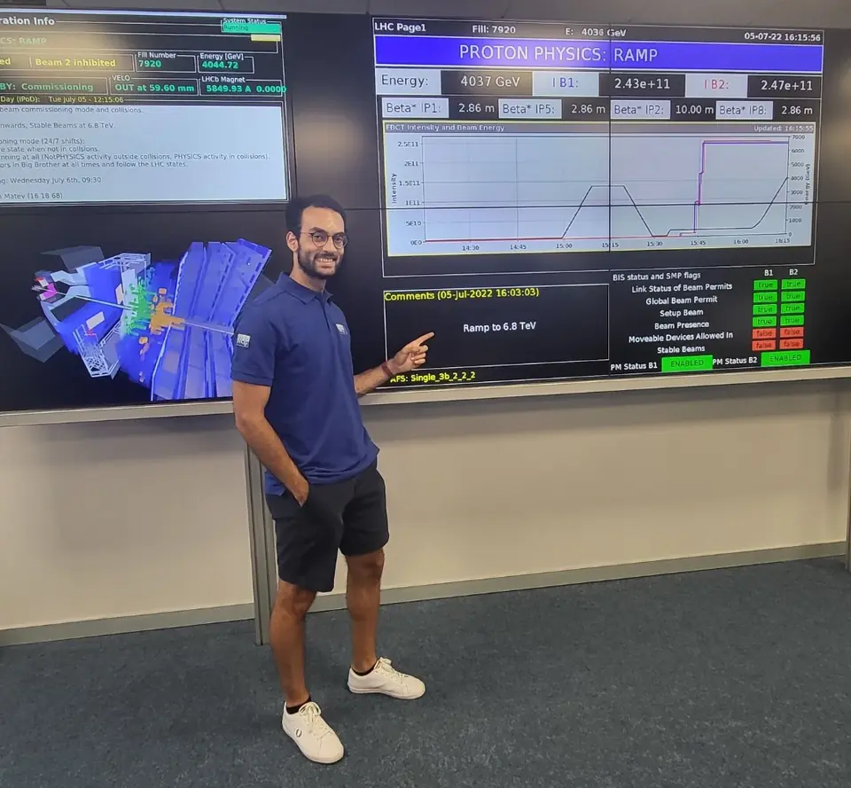 Ahmed in the LHCb control room in front of LHC status screens
